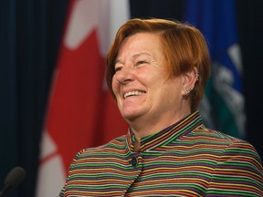 MLA Laurie Blakeman speaks to the media following the opening of the spring session and the passing of Bill 10 at the Alberta Legislature, in Edmonton Alta., on Tuesday March 10, 2015. David Bloom/Edmonton Sun/Postmedia Network