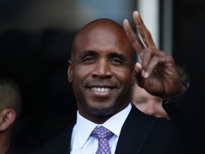 Former San Francisco Giants player Barry Bonds gestures to the media outside the Phillip Burton Federal Building after he was found guilty of obstruction of justice in San Francisco, Calif., in this April 13, 2011, file photo. (REUTERS/Stephen Lam/Files)