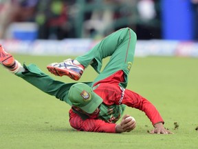 Bangladesh cricketer Nasir Hossain catches to dismiss Pakistan cricketer Fawad Alam during the third One Day International cricket match between Bangladesh and Pakistan at the Sher-e-Bangla National Cricket Stadium in Dhaka on Tuesday. (AFP PHOTO / Munir uz ZAMAN)