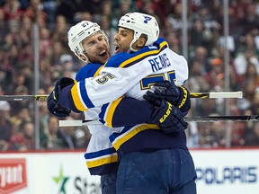 St. Louis Blues forward Ryan Reaves celebrates his goal with defenceman Alex Pietrangelo during the first period in Game 3 of the first round of the 2015 NHL playoffs against the Minnesota Wild at Xcel Energy Center on April 22, 2015. (Brace Hemmelgarn/USA TODAY Sports)