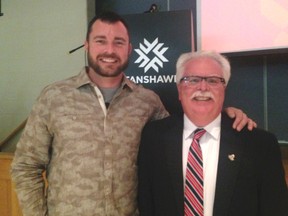 Retired Canadian Armed Forces sniper and double amputee Jody Mitic (left) poses with Ross Fair, chair of the Fanshawe College St. Thomas/Elgin Regional Campus at a student awards ceremony Wednesday evening. Metic, who lost his legs in the line of duty, was the keynote speaker at the dinner and awards ceremony.