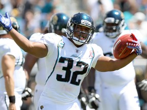 Running back Maurice Jones-Drew of the Jacksonville Jaguars celebrates after scoring a touchdown against the Tennessee Titans during the first quarter of their NFL football game in Jacksonville, Florida September 11, 2011. (REUTERS)