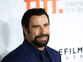 John Travolta at the premiere of The Forger at Roy Thomson Hall during the Toronto International Film Festival in Toronto on Friday September 12, 2014. Michael Peake/Toronto Sun/Postmedia Network