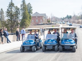 To mark the occasion, City of Markham officials and Kylemore's Patrick O'Hanlon and Frank Spaziani were the first to cross Blackstock Bridge and likely the only ones to do so in golf carts.