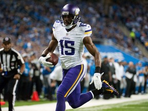 Minnesota Vikings wide receiver Greg Jennings (15) runs into the end zone for a touchdown during the second quarter against the Detroit Lions at Ford Field. (Tim Fuller-USA TODAY Sports)