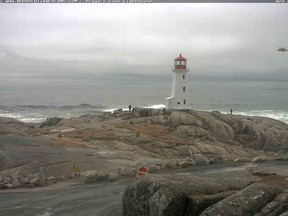 A rescue chopper is seen at Peggy’s Cove in Nova Scotia on April 22, 2015 in this screengrab from Nova Scotia Webcams.