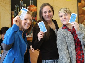 Lindsay from Libro, Sydney Ryan and Kacy Viau show off Libro’s $5 coupon at Subway last Wednesday during the “cash mob”. (Laura Broadley Clinton News Record)
