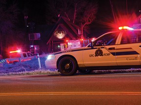 Fire crews and RCMP responded to reports of a confirmed structure fire late Sunday night in Pincher Creek. Damage could be seen on the roof of the house. John Stoesser photo/Pincher Creek Echo.