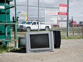 A number of old television sets, blatantly left in sight of signs that explicitly prohibit throwing out electronics and other such waste at the green MD dumpsters. Council approved the purchase of high definition video surveillance equipment for the waste collection site on April 15, 2015. John Stoesser photos/Pincher Creek Echo.
