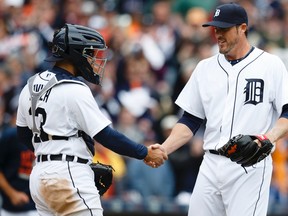 Detroit Tigers closer Joe Nathan (right) and catcher Alex Avila celebrate after a win over the Minnesota Twins at Comerica Park. (Rick Osentoski/USA TODAY Sports)