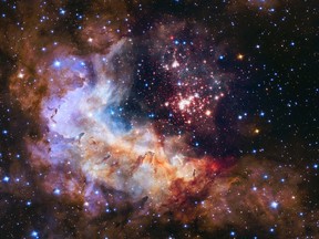 A stellar nursery of about 3,000 stars called Westerlund 2 located about 20,000 light-years from Earth in the constellation Carina in a photo taken by the Hubble Space Telescope released April 23, 2015. (NASA)
