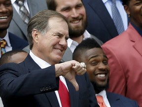 New England Patriots head coach Bill Belichick gives a thumbs down to a joke about deflated balls by U.S. President Barack Obama during a reception for the Super Bowl champion New England Patriots at the White House in Washington April 23, 2015. (REUTERS/Jonathan Ernst)