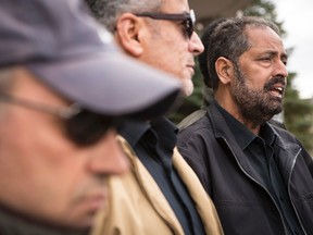 Amrik Singh (right), president of Unifor local 1688, which represents taxi drivers in Ottawa, speaks outside of the Provincial offences court offices in Ottawa following guilty pleas by Uber drivers on Thursday, April 23, 2015. Errol McGihon/Ottawa Sun/Postmedia Network