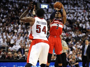 Washington Wizards guard Bradley Beal takes a shot over Toronto Raptors forward Patrick Patterson in Game 2. (Peter Llewellyn-USA TODAY Sports)