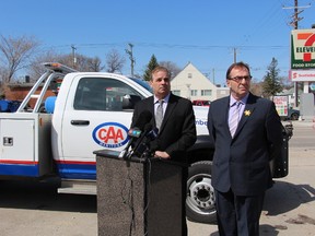 Mike Mager, president and CEO of CAA Manitoba (left), and Ron Kostyshyn, Manitoba's minister of infrastructure and transportation, announced CAA's Worst Roads winner April 23, 2015.
