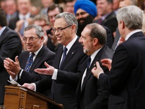 Canada's Finance Minister Joe Oliver delivers the federal budget in the House of Commons, as Prime Minister Stephen Harper applauds (R) on Parliament Hill in Ottawa April 21, 2015. REUTERS/Chris Wattie