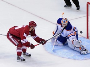 Arizona Coyotes left wing Mikkel Boedker (89) scores on Edmonton Oilers goalie Ben Scrivens on a breakaway during NHL action at Gila River Arena. (Matt Kartozian/USA TODAY Sports)