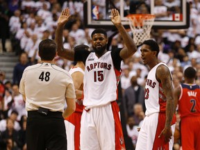Toronto Raptors' Amir Johnson (15) and Lou Williams argue with referee Scott Foster in Game 2 against the Washington Wizards. (Jack Boland/Toronto Sun/Postmedia Network)