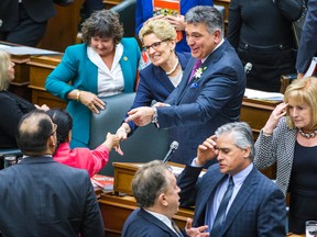 Minister of Finance Charles Sousa and Premier Kathleen Wynne after the release of the 2015 Ontario Budget at Queen's Park on April 23, 2015. (Ernest Doroszuk/Toronto Sun)