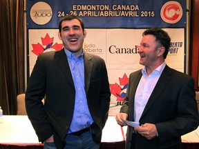 Nicolas Gill (left) and Mark Hicks share a laugh at Sutton Place on April 23, 2015, before a press conference kicking off the 2015 Pan-American Judo Championships.