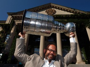 Peter Chiarelli, shown here with the Stanley Cup at the University of Ottawa, his alma mater, is credited with rebuilding the Boston Bruins after the team missed the playoffs in 2006. (QMI Agency file)