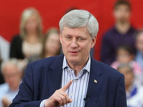 Prime Minister Stephen Harper speaks before more than 300 supporters at the Victoria Inn Convention Centre on Thursday. (Kevin King/Winnipeg Sun/Postmedia Network)