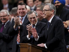 Finance Minister Joe Oliver receives a standing ovation while delivering the federal budget in the House of Commons on Parliament Hill in Ottawa, April 21, 2015. REUTERS/Chris Wattie