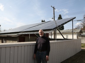 Emanuel Blosser installed this solar panel system on his garage to help him reduce his net energy consumption to zero.