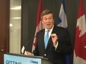 Mayor John Tory speaks to reporters on Friday, April 24, 2015. (DON PEAT/Toronto Sun)