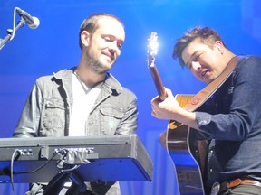 Ben Lovett and Marcus Mumford of Mumford & Sons perform on stage. (Postmedia Network file photo)