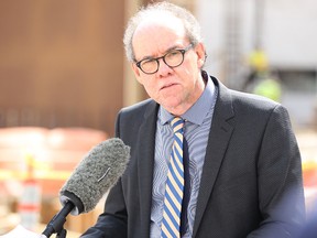 Finance Minister Greg Dewar listens to a question after announcing the province has pushed back its date to deliver a balanced budget until 2019 at the University of Winnipeg Commons project on Colony Street in Winnipeg on Fri., April 24, 2015. Kevin King/Winnipeg Sun/Postmedia Network