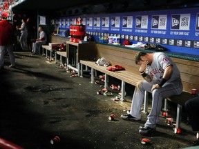 Josh Hamilton of the Los Angeles Angels sits in the dugout after scoring a run in the sixth inning of a baseball game against the Texas Rangers at Rangers Ballpark in Arlington on April 7, 2013. (Brandon Wade/Getty Images/AFP)
