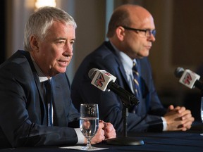 (left to right) Oilers Entertainment Group chief executive Bob Nicholson announces Peter Chiarelli as the Edmonton Oilers new President and General Manager during a press conference at The Fairmont Hotel Macdonald, in Edmonton, Alta. on Friday April 24, 2014. David Bloom/Edmonton Sun/Postmedia Network
