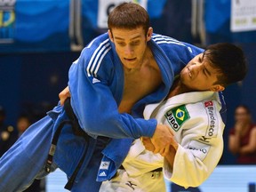 Canada's Patrick Gagne, left, lost this bout with world champion Charles Chibana of Brazil (AFP).