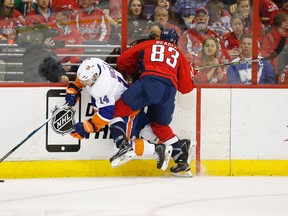 Washington Capitals centre Jay Beagle checks New York Islanders defenceman Thomas Hickey during Game 5 on Thursday night. (USA TODAY SPORTS)