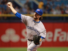 Toronto Blue Jays starting pitcher R.A. Dickey throws a pitch during the first inning against the Tampa Bay Rays at Tropicana Field on April 24, 2015. (Kim Klement/USA TODAY Sports)