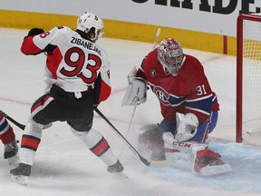 Ottawa Senators Bobby Ryan scores on Montreal Canadiens Carey Price during first period action at the Bell  Centre in Montreal Friday April 24, 2015. Senators Mika Zibanejad waits to see if there is going to be a rebound. Tony Caldwell/Postmedia Network