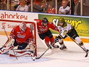 Generals goalie Ken Appleby keeps his eye on the puck as teammate Cole Cassels chases Zach Bratina of the North Bay Battalion during Game 1 of their Ontario Hockey League best-of-seven Eastern Conference final on Friday night in Oshawa. The visitors won 6-1 for an early series lead in a rematch of last year’s conference final. (DAVE THOMAS/TORONTO SUN)