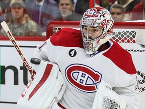 Montreal Canadiens goaltender Carey Price makes a save against the Ottawa Senators during NHL action at Canadian Tire Centre on April 22, 2015. (Errol McGihon/Ottawa Sun/Postmedia Network)