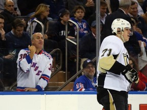 A New York Rangers fan taunts Evgeni Malkin #71 of the Pittsburgh Penguins during the third period in Game Five of the Eastern Conference Quarterfinals during the 2015 NHL Stanley Cup Playoffs at Madison Square Garden on April 24, 2015 in New York City. Bruce Bennett/Getty Images/AFP