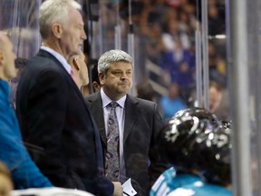 Apr 1, 2014; San Jose, CA, USA; San Jose Sharks head coach Todd McLellan watches the game from the bench during the first period against the Edmonton Oilers at SAP Center at San Jose. Mandatory Credit: Bob Stanton-USA TODAY Sports