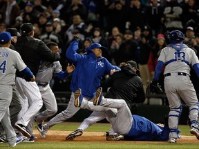 Jeff Samardzija of the Chicago White Sox (middle) falls during a bench-clearing fight against the Kansas City Royals on April 23, 2015 at U.S. Cellular Field in Chicago. (Jon Durr/Getty Images/AFP)