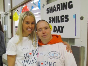 Dr. Jessica Bourassa shares a moment with Daryl Card during the first annual Sharing Smiles Day on Saturday April 25, 2015 in Sarnia, Ont. The day was organized by the Sarnia chapter of Oral Health, Total Health, a not-for-profit group promoting healthy oral care for adults with special needs. Paul Morden/Sarnia Observer/Postmedia Network