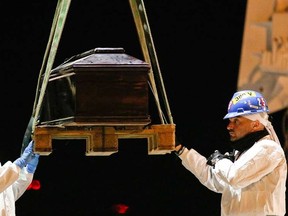 A coffin, containing the body of a migrant who died while trying to reach Italy, is carried off a navy ship at the Sicilian harbour of Augusta March 4, 2015. At least 10 North African migrants died when their rubber boat overturned in the southern Mediterranean while more than a thousand more were rescued from eight other vessels over Tuesday and Wednesday, Italian and Tunisian authorities said. The survivors were taken to ports in Italy -- part of a growing surge of people risking the dangerous journey to flee poverty, civil war in Syria, military conscription in Eritrea, anarchy in Libya and other conflict zones.  REUTERS/Antonio Parrinello