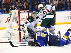 Wild goalie Devan Dubnyk makes a save on Vladimir Tarasenko of the Blues on Friday night. Minnesota won the game 4-1 and can close out the series on Sunday. (GETTY IMAGES/AFP)
