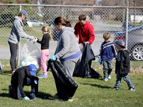Residents of Belleville's east end pick up trash along the fence line of Moira Secondary School's football field and track. They found such items as old sport socks and discarded mouth guards. 
Trash Bash took place Saturday. 
Emily Mountney-Lessard/Belleville Intelligencer/Postmedia Network