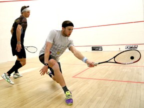 L.J. Anjema, left, of the Netherlands, and Ryan Cuskelly, of Australia, battle in the finals of the 2015 Northern Ontario PSA Squash Championships at the YMCA  in Sudbury, Ont. on Saturday April 25, 2015.