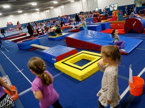 Visitors check out the Quinte Bay Gymnastics Club at the club's new Harder Drive location (formerly the Dick Ellis arena) during a celebration and open house Sunday, April 26, 2015, in Belleville, Ont. 
Emily Mountney-Lessard/Belleville Intelligencer/Postmedia Network