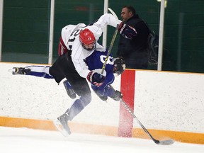 Defenceman Carson Moniz laid a heavy hipcheck on forward Owen Lane during the Sudbury Wolves orientation camp scrimmage Sunday April 26, 2015 at Gerry McCrory Countryside Sports Complex on Sunday morning.