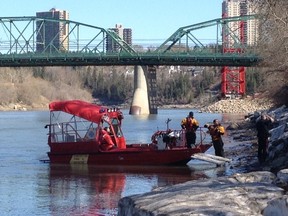 Police respond to a call of a body found along the North Saskatchewan River on Sunday, April 26, 2015. Police do not suspect foul play. David Bloom/Edmonton Sun/Postmedia Network